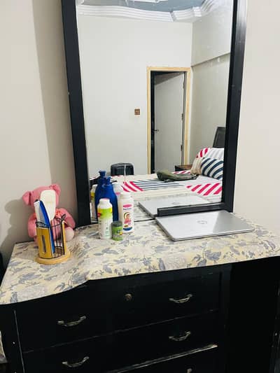 Used bed set with side tables and a dressing table