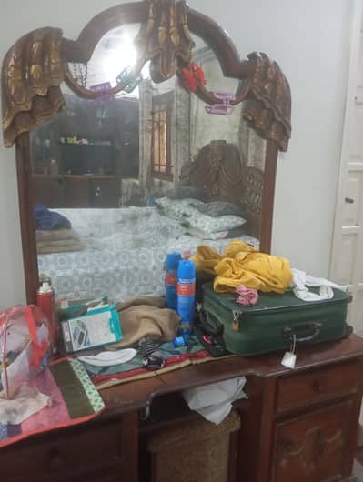 Used wooden bed with dressing table