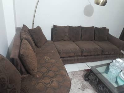 Brown L shaped sofa
