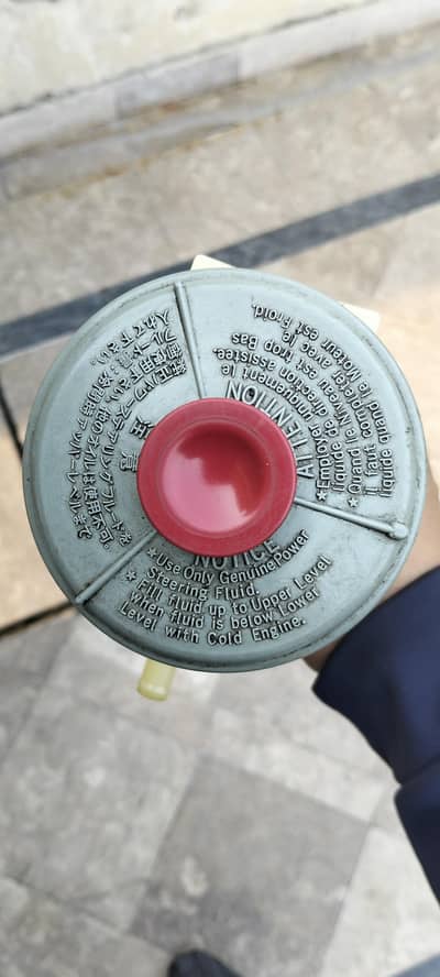 Power steering fluid reservoir