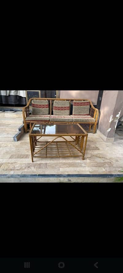 Cane sofa with table