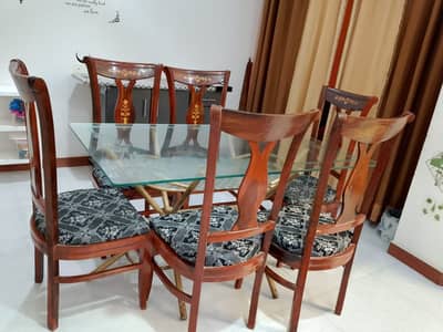 Glass top Dining table with Six Wooden chairs