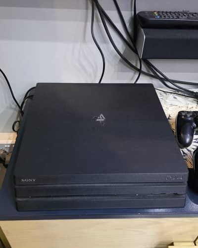 PS4 Pro 1tb, 2 Original Controllers and 4 Games