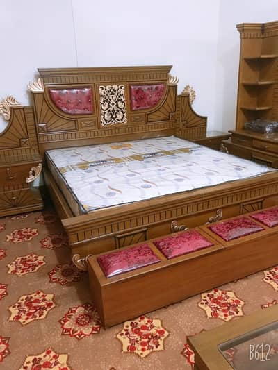 Double bed with side table and dressing table