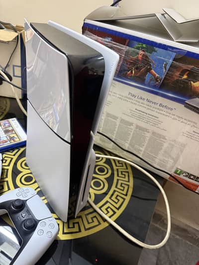 Ps 5 slim disk addition 1tb uk model with 2 orginal remotes 2 games