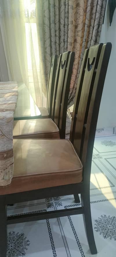 Dinning table with 6 chairs and one dinning table with glass top