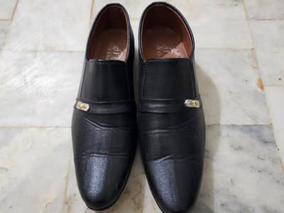 Men formal black shoes.