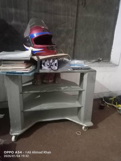 a table with 2 glasses and has wheels