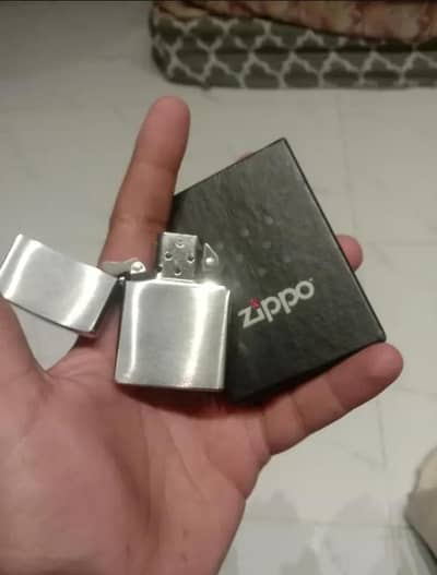 Genuine Zippo lighter, Made in USA, never used. Nigotiable
