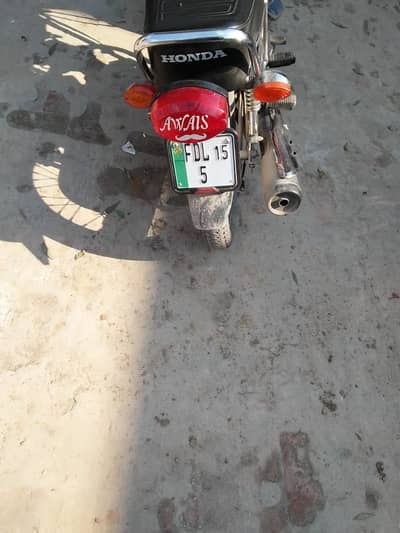 Honda 125 model 15 with golden number 5 for sale