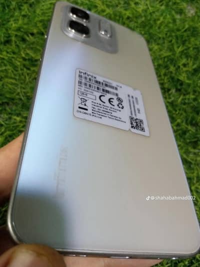 infinix Hot 50i phone silver color with 1 case and cable