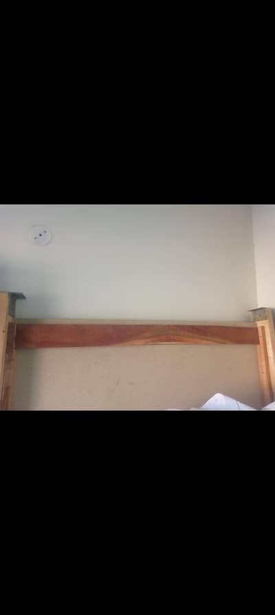 solid wood bed in  good condition