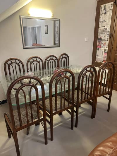 8-seater glass top wooden dining table