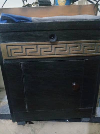 Slightly used wooden bed with side tables