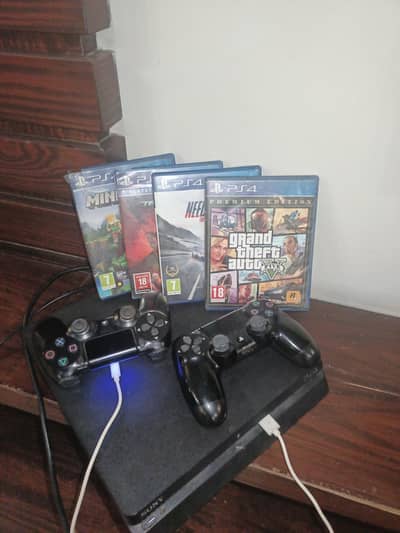 Ps4 slim with 4 games and 2 controllers
