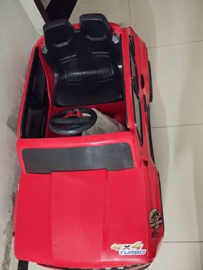 Kids battery operated car (remote and manual) new condition