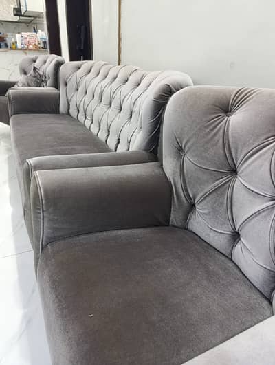 s vintage style grey 5 seater sofa.