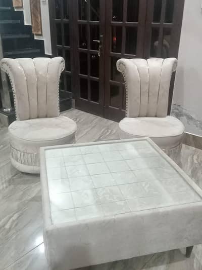 Two sofa chairs and one table