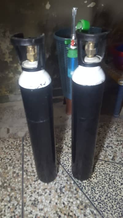 Oxygen Cylinders 2 and 1 Regulator Available