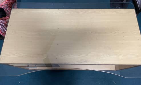 Office table in good condition pure wood with glass top.