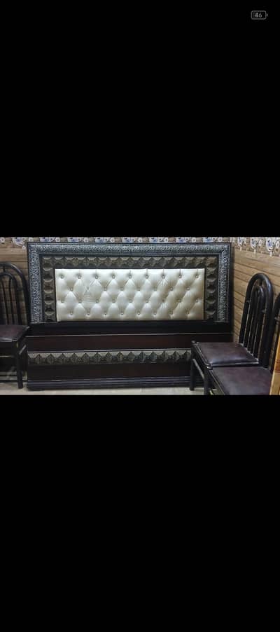 double bed with 3 chairs