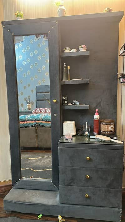king size bed and a matching dressing table with mirror.