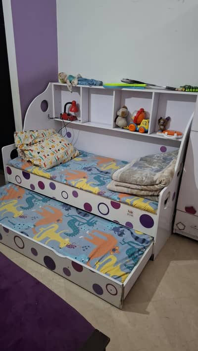 2 single beds study table chair with one kids cupboard