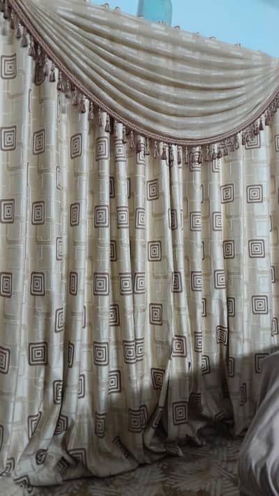 4 panels of fancy curtains