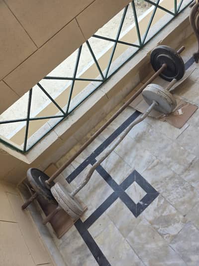 weight lifting bars with weights - used