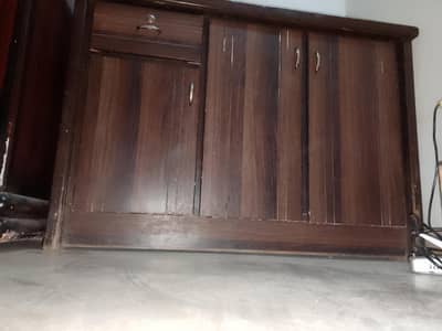 Table with attach scelf and cabinets , upper side iron rack