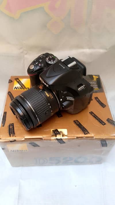 Nikone D5200 for sale new Camera with 1855 lens condition 10 by 10