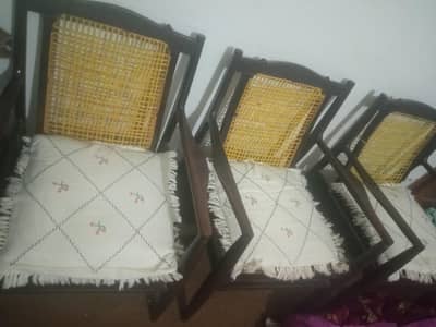 set of four chairs and iron charpai