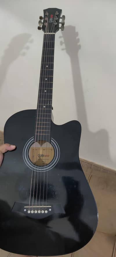 A new beginner guitar for sale with perfect sound .