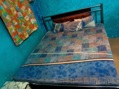 king size iron bed and king size spring mattress  and  dressing table.