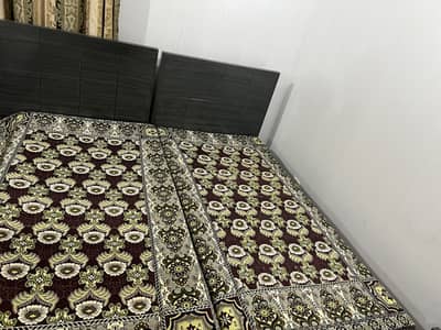 2 single beds with mattresses