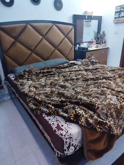 bed and side dressing with mirror