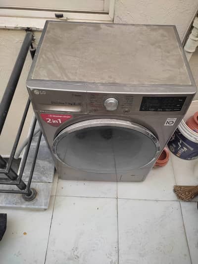 LG Front Load washing machine 7/4 KG with steam dryer.