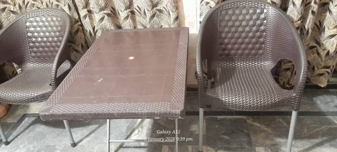 Six Plastic Charis and one table