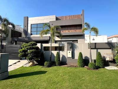 One Kanal Brand New Luxury Ultra-Modern Design Most Beautiful Fully Furnished Bungalow 2 Servant Quarter In Basement For Sale At Prime Location Of DHA Lahore Near To Park Masjid & Commercial Market.