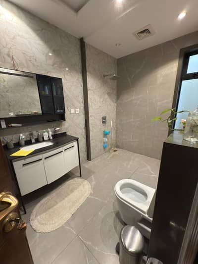 10 Marla Slightly used Like Brand New Eye Catching Modern Design Full Basement Bungalow Demand 495Lac