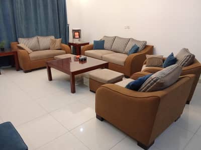 7 seater sofa with 2 ottomans/stools