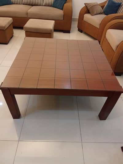 Wooden Central table with two side tables.