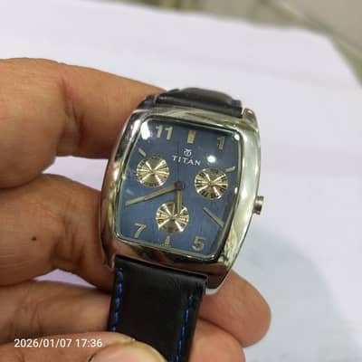 Beautiful titan watch with leather band, All stainless steel.