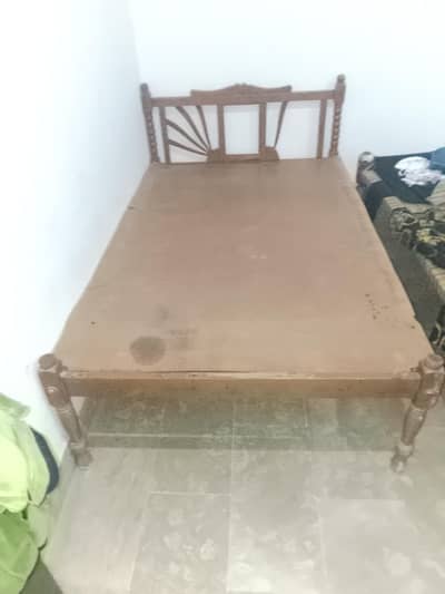 single wooden bed from Multan. . . .