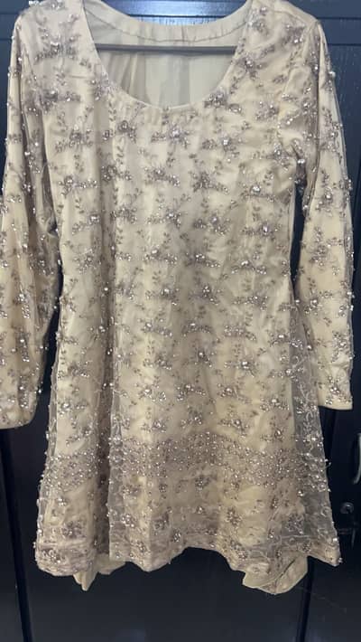 A party wear shirt of size medium.