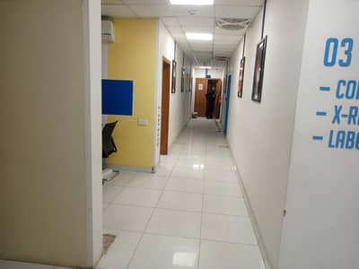 1 kanal commercial ground floor Hall for rent multinationals Brands and office's at the hot location of JOHAR town phase 2 near emporium mall