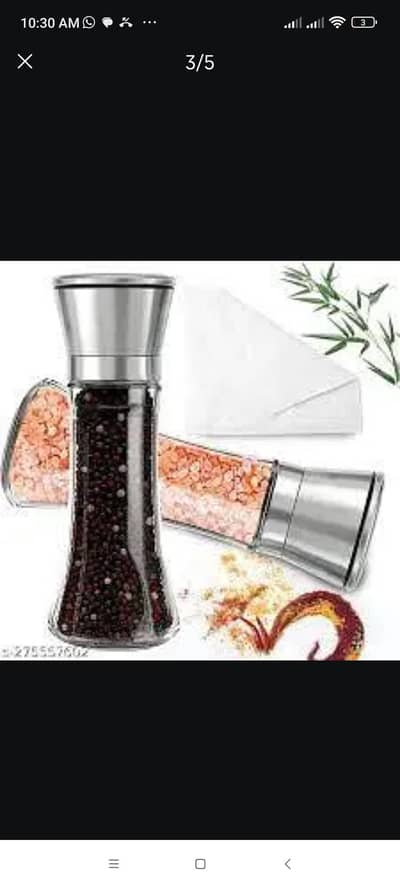 glass bottles with grinder for salt and black paper