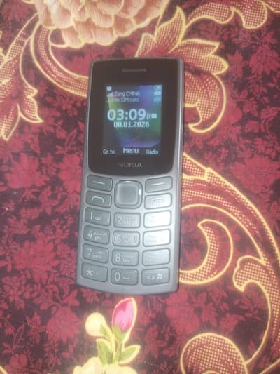 Original Nokia 106 with box and charger.