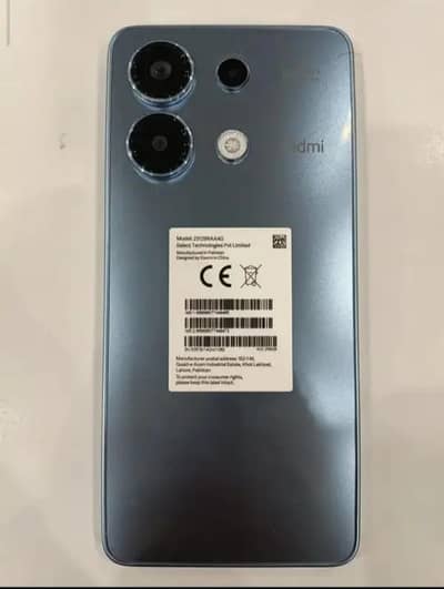 Xiaomi redmi note 13 with bow and charger