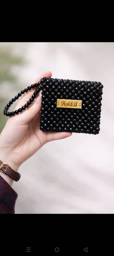 black beaded mini pouch with golf strap